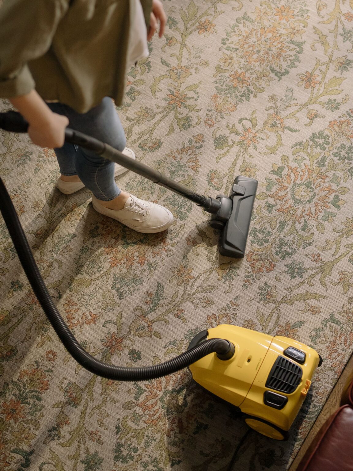 Vacuuming a classroom floor after hours