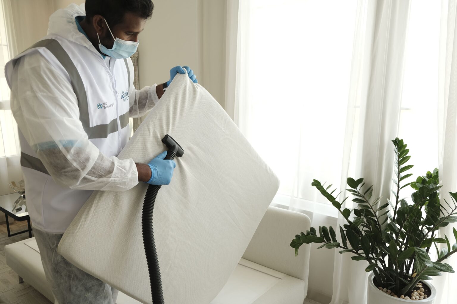 Disinfecting a commercial interior in protective equipment