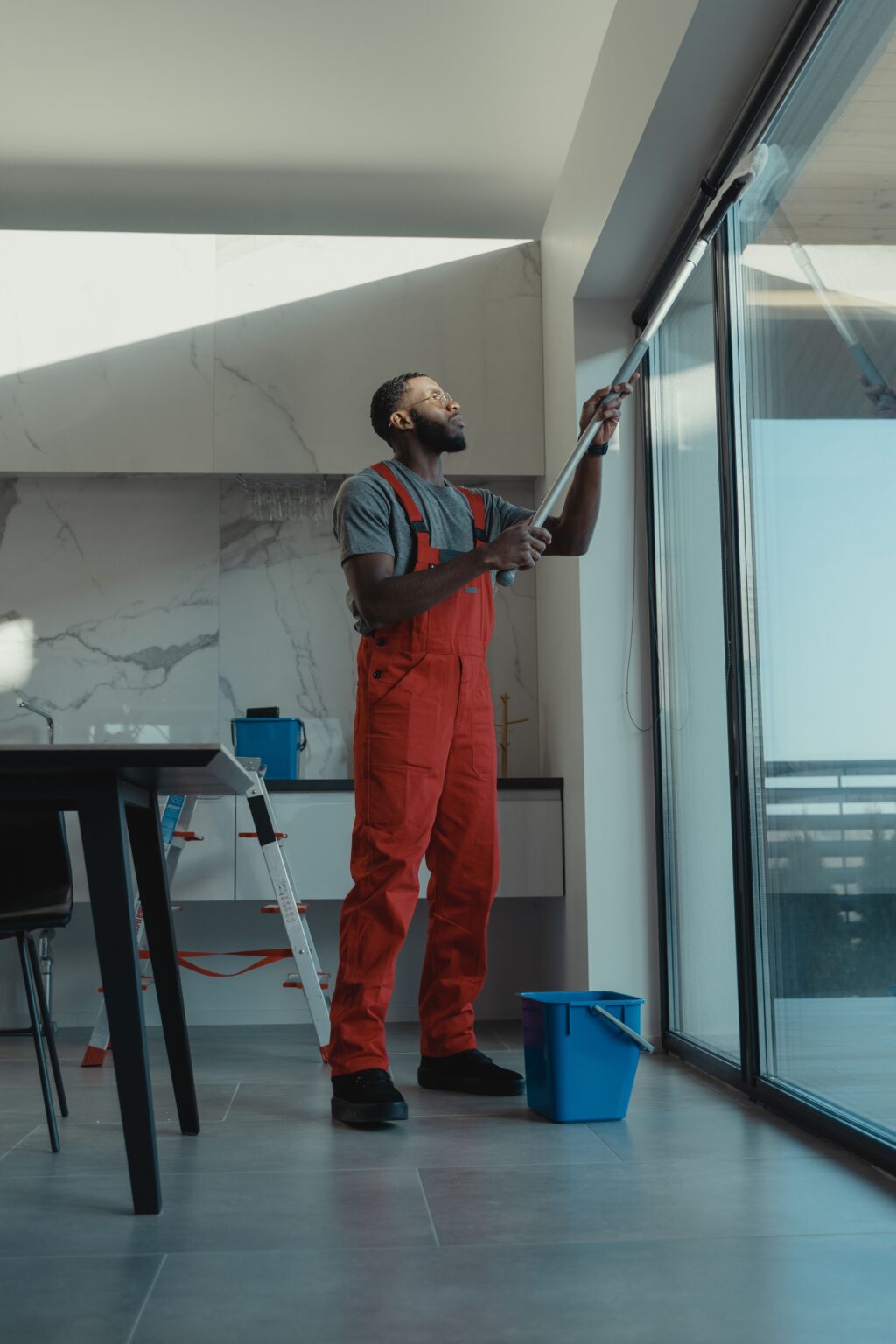 A Final Touch cleaner in uniform working in a commercial corridor