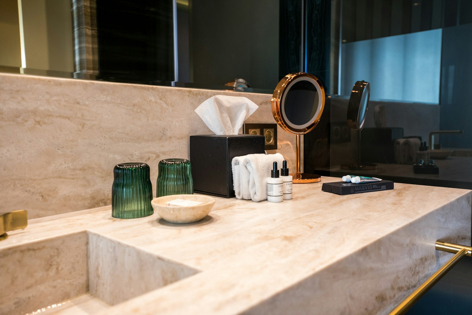 Bathroom sink and vanity cleared of toiletries so the surfaces can be cleaned